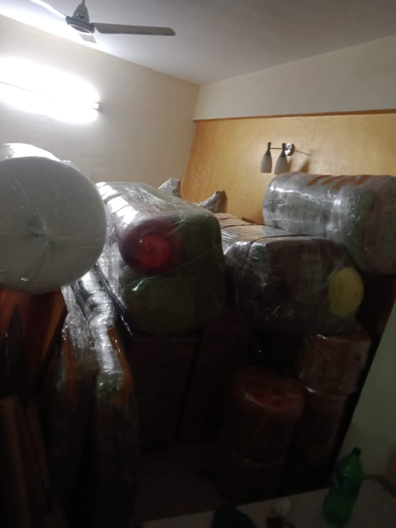 Team lifting furniture during shifting