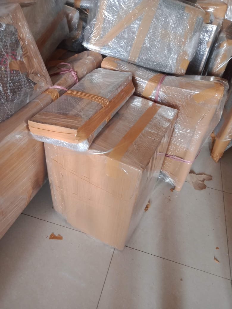 Packers organizing goods for moving