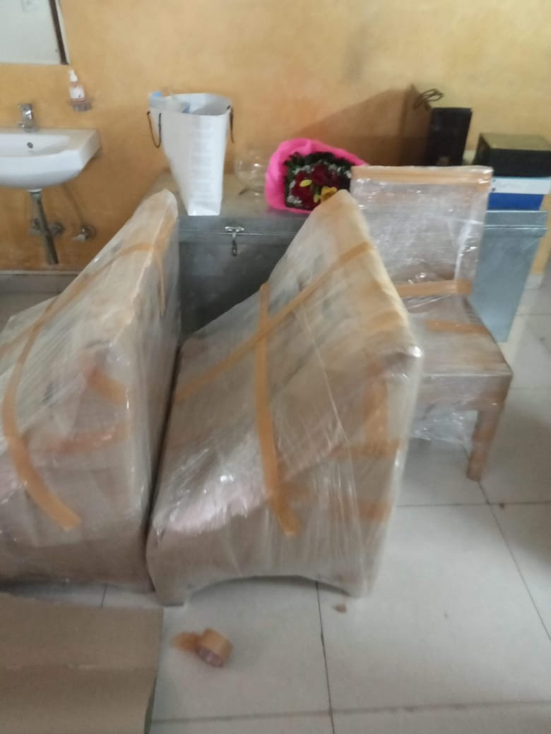 Movers unloading boxes at new location