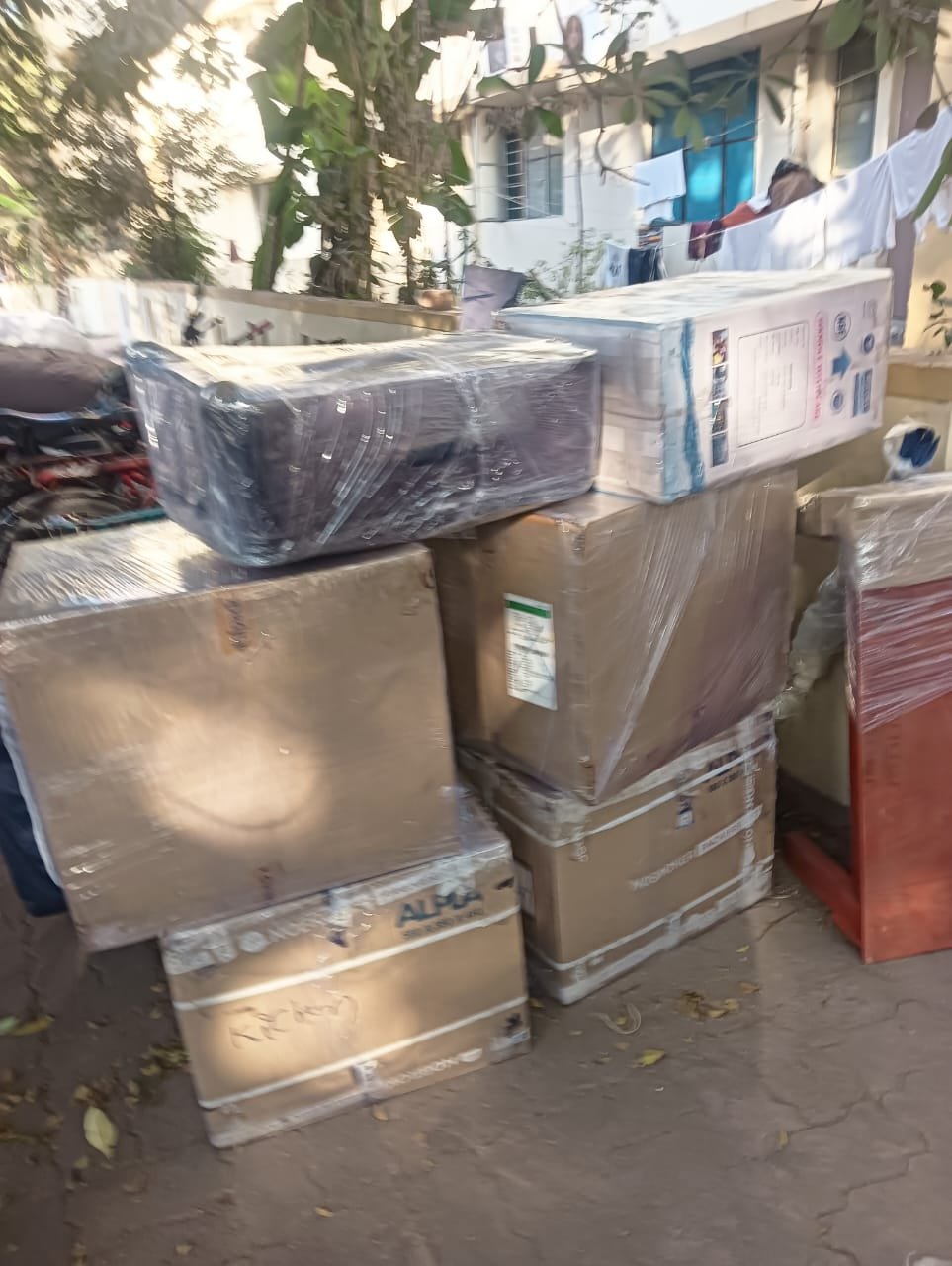 Movers carrying furniture during shifting